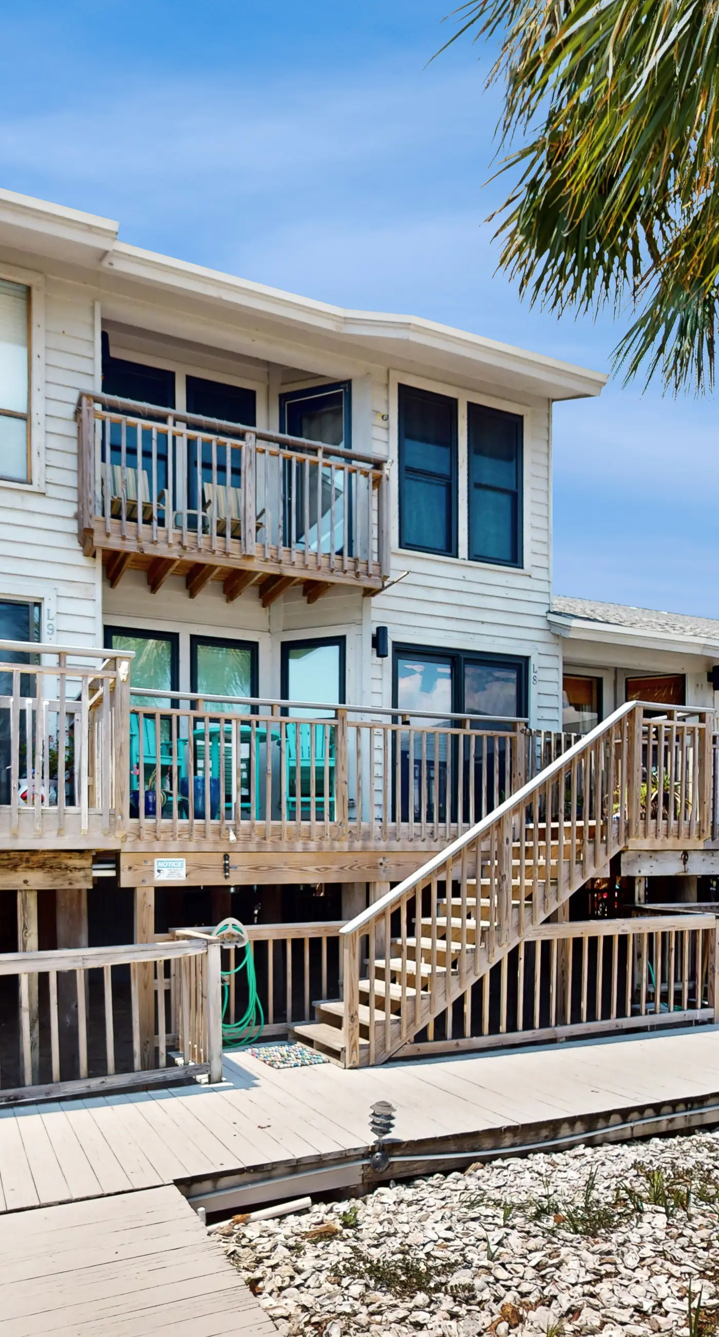 Comfortable townhome steps from beach with pool access, balcony, & W/D