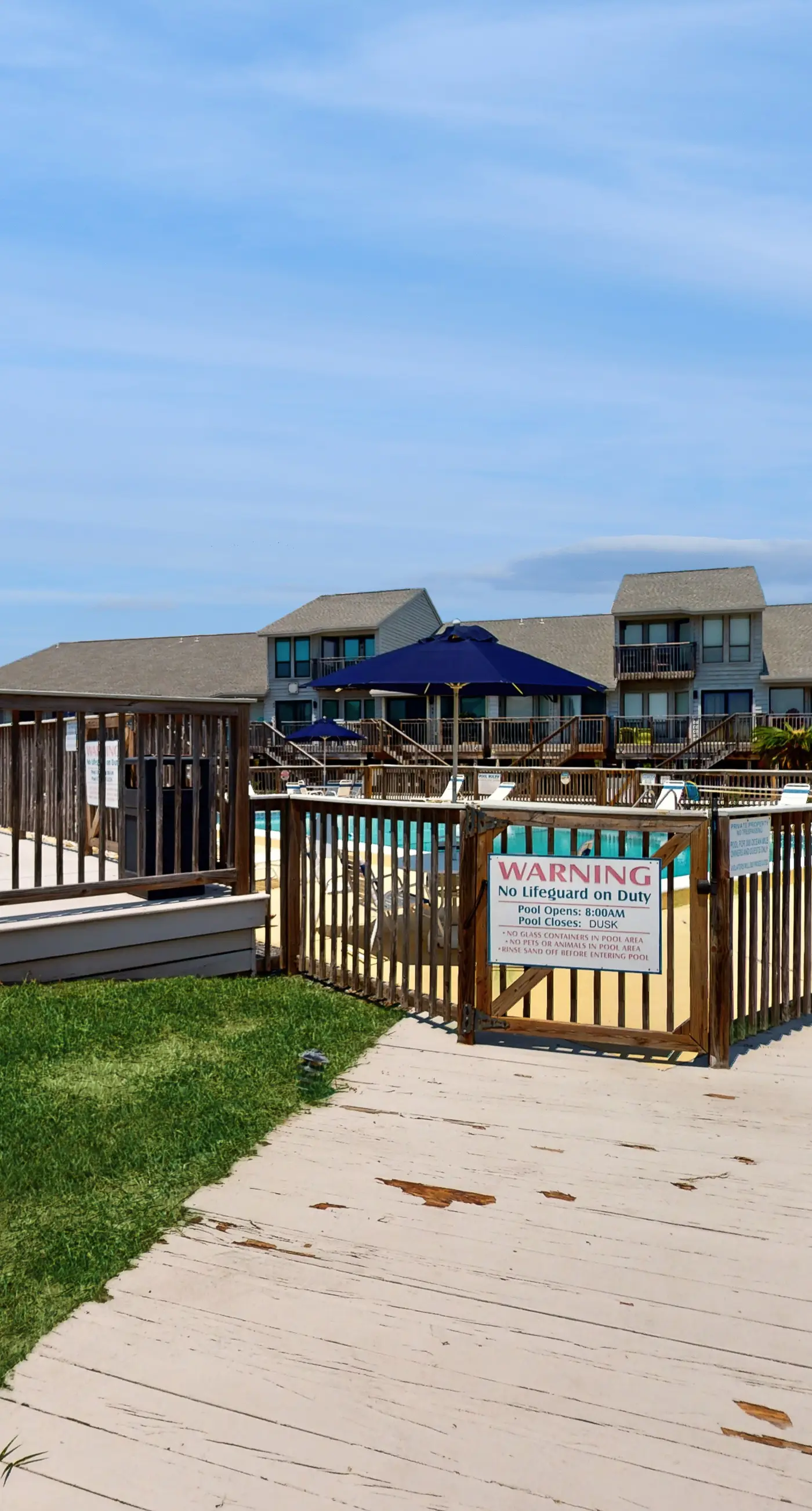 Comfortable townhome steps from beach with pool access, balcony, & W/D