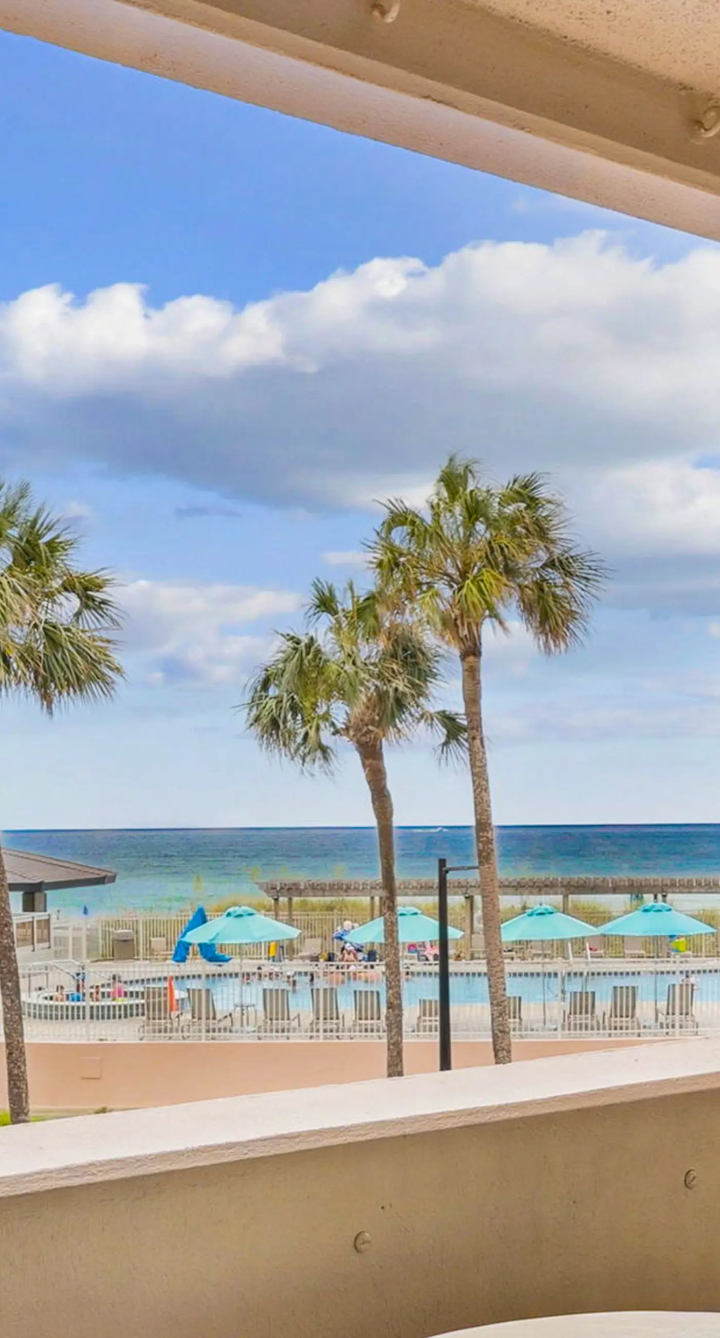 Bright ocean-view condo with community pool and direct beach walkway