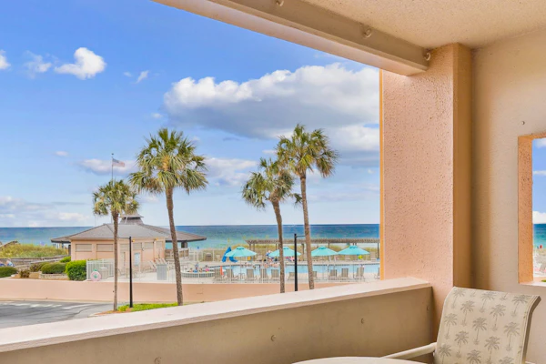 Bright ocean-view condo with community pool and direct beach walkway