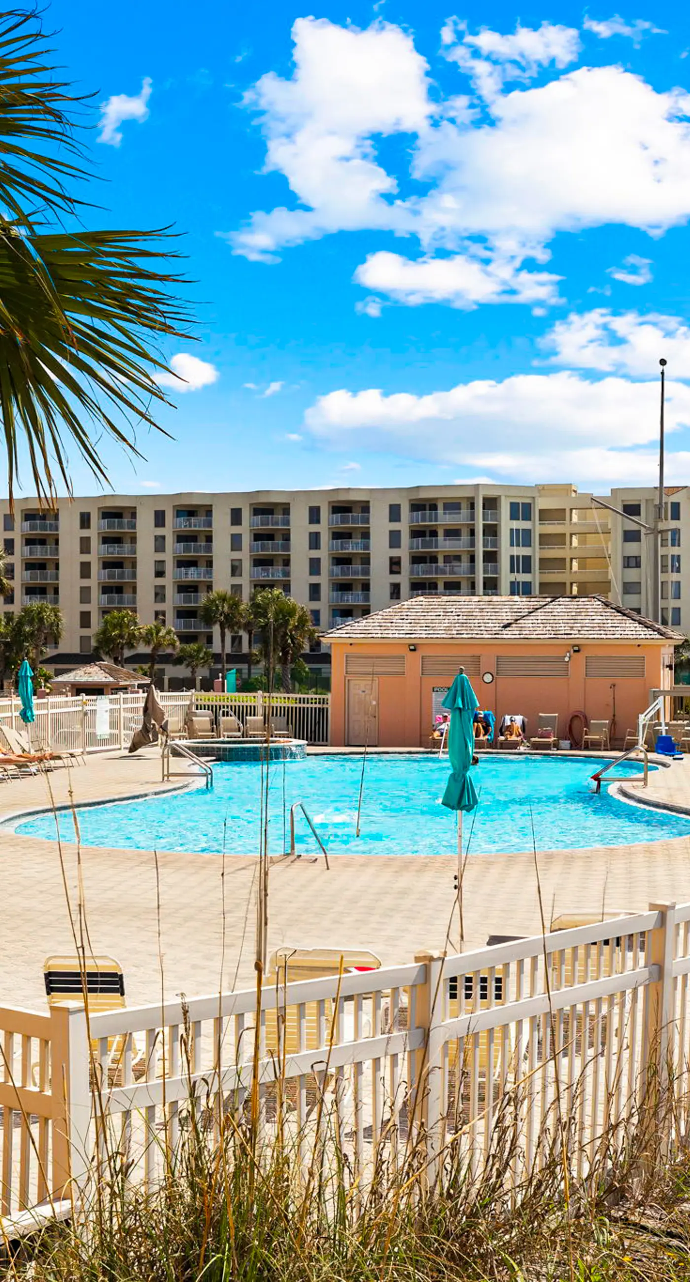 Bright ocean-view condo with community pool and direct beach walkway