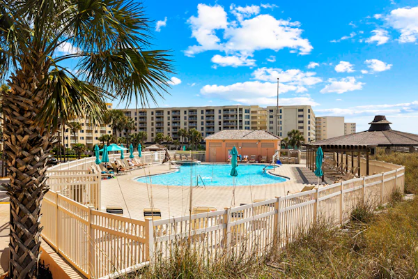 Bright ocean-view condo with community pool and direct beach walkway