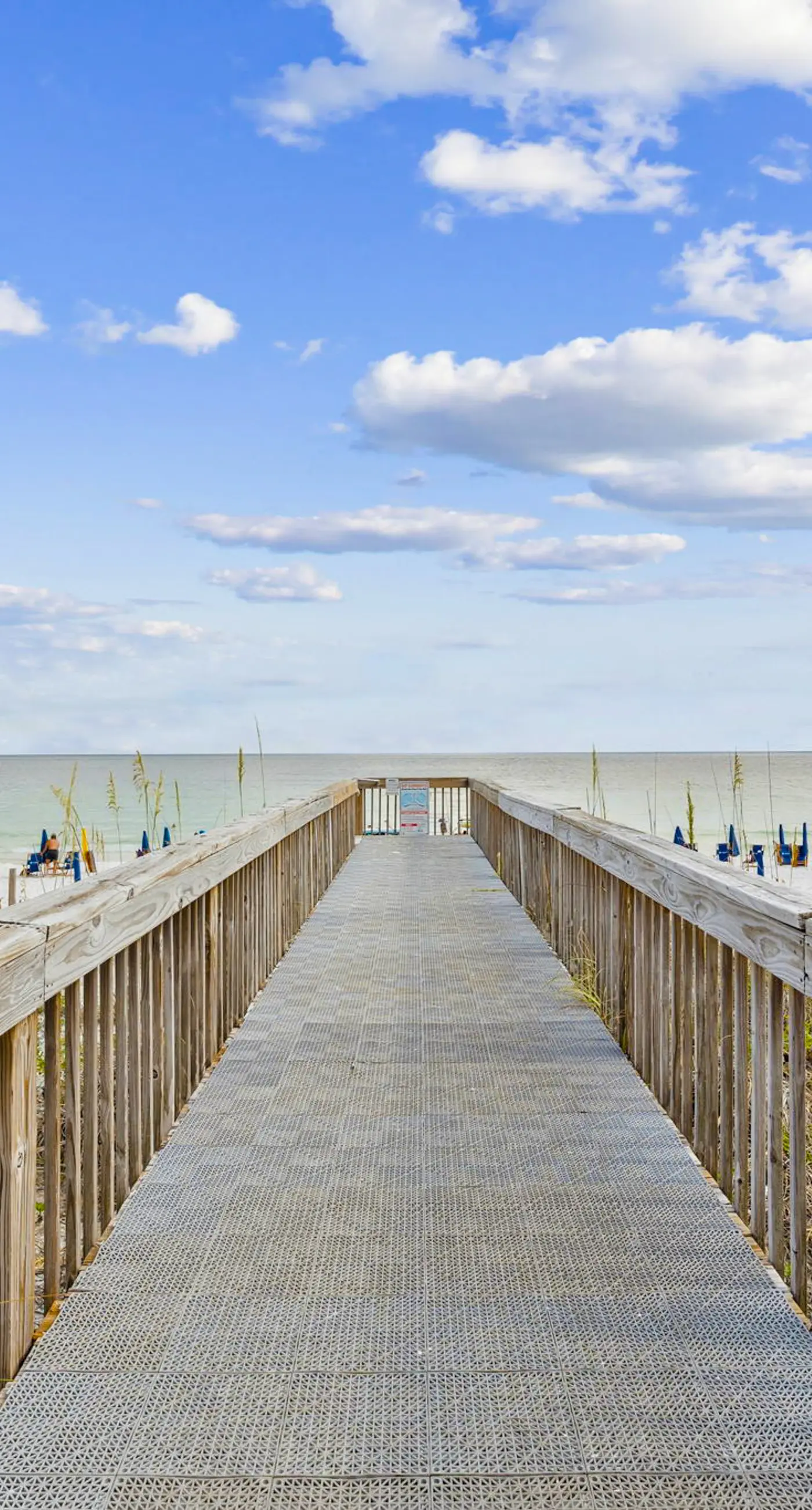 Bright ocean-view condo with community pool and direct beach walkway