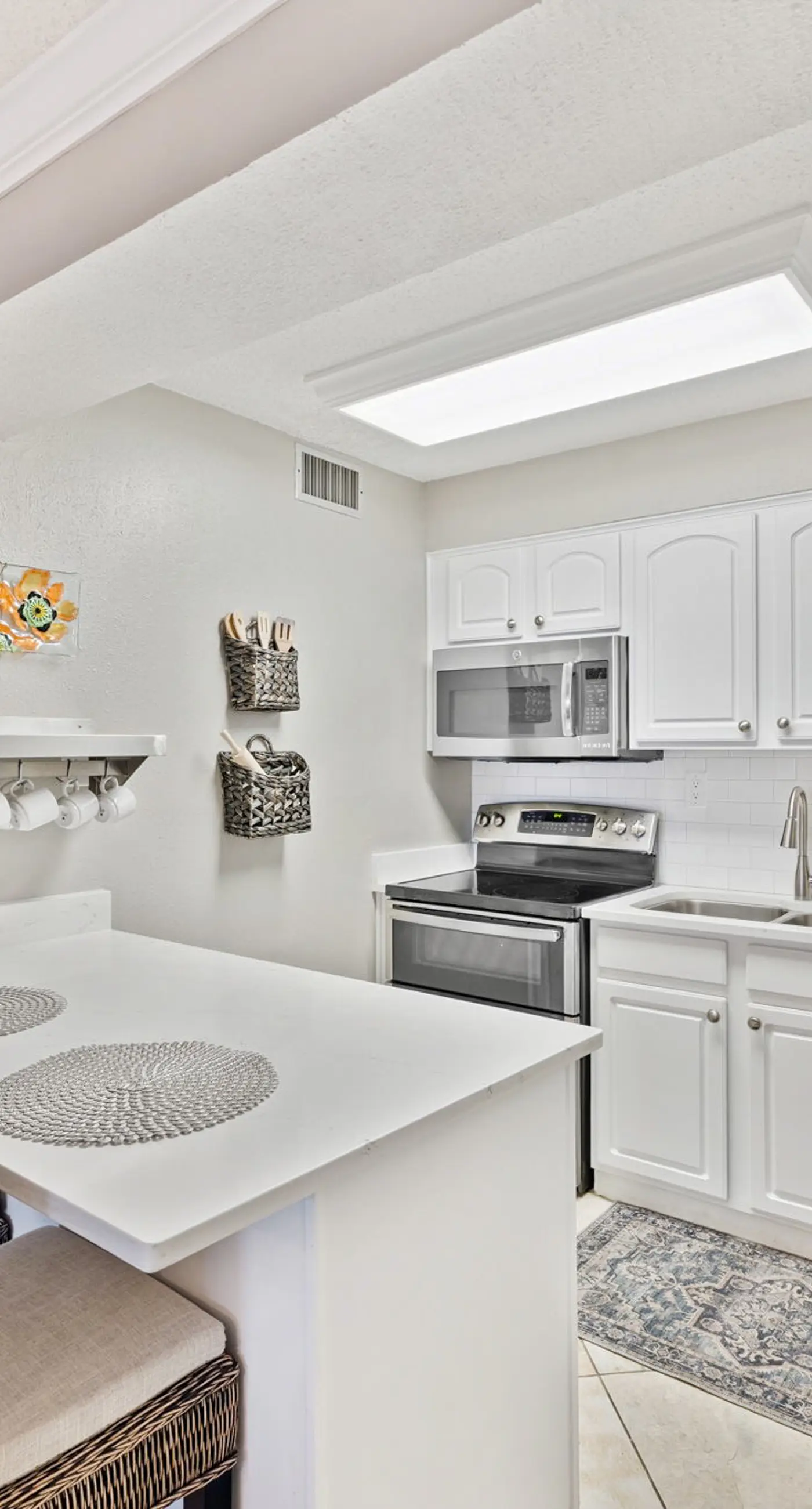 Bright ocean-view condo with community pool and direct beach walkway