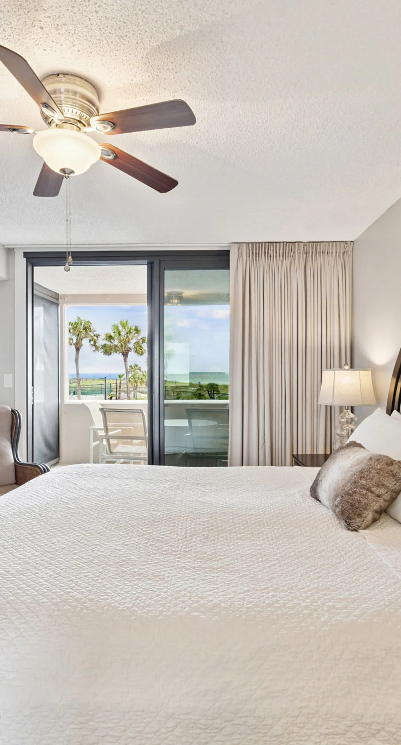 Bright ocean-view condo with community pool and direct beach walkway