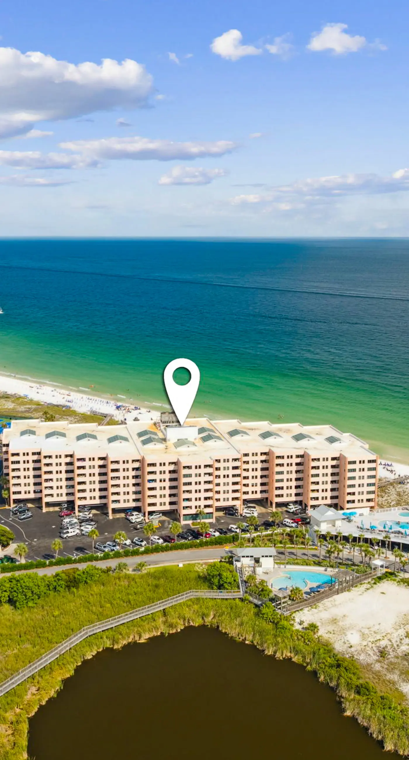 Bright ocean-view condo with community pool and direct beach walkway