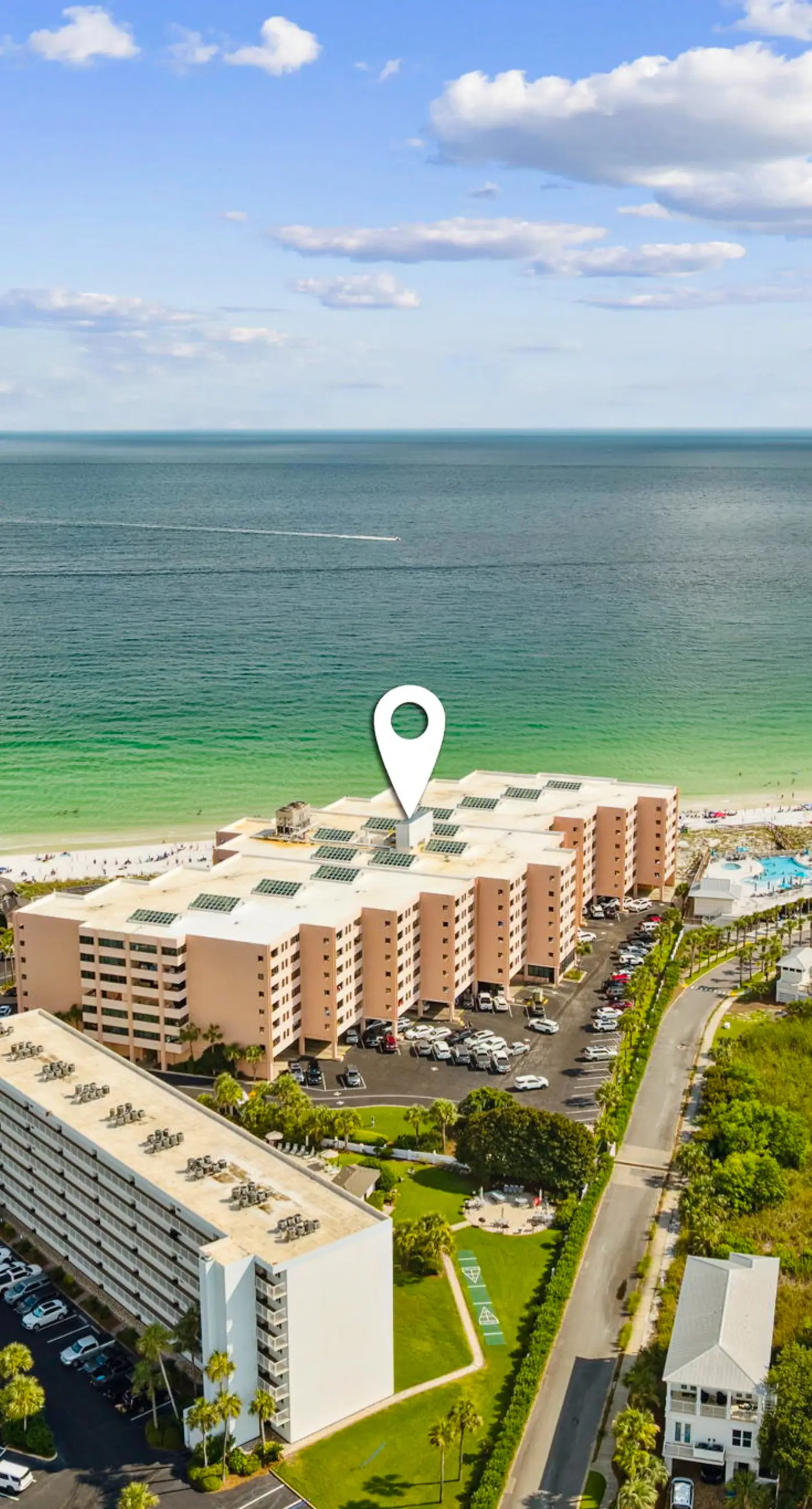 Bright ocean-view condo with community pool and direct beach walkway