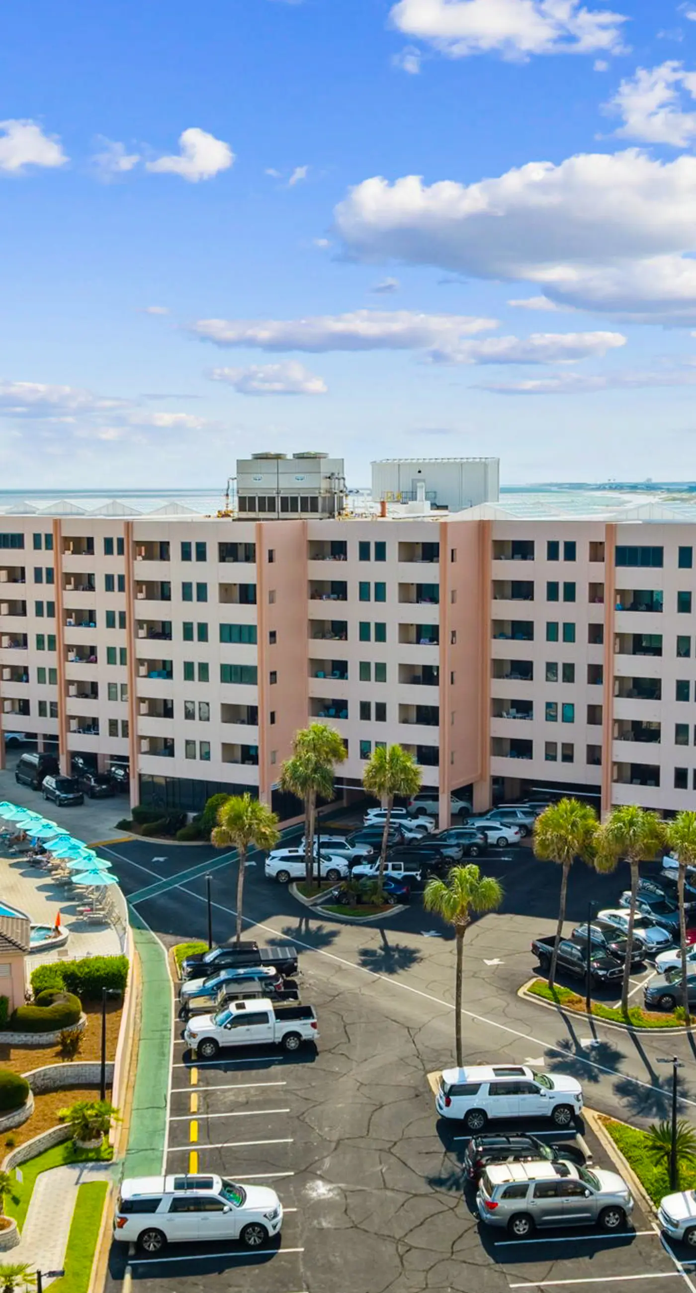 Bright ocean-view condo with community pool and direct beach walkway