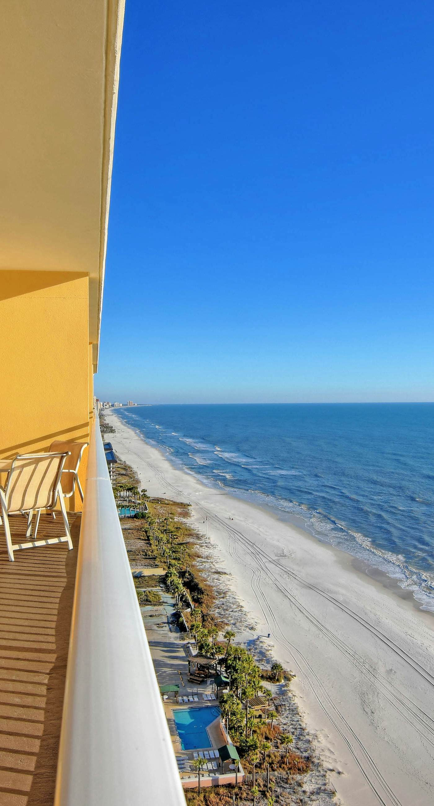 Waterfront condo with a balcony overlooking the Gulf, pool & a gym