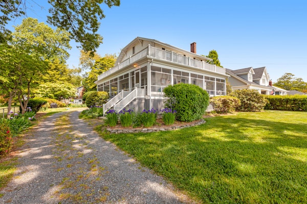 Waterfront home with scenic porches, yard, grill, jetted tub, central AC, & W/D