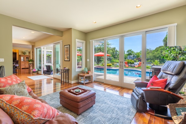 Lakefront home with private pool, hot tub, outdoor space, central AC, & W/D