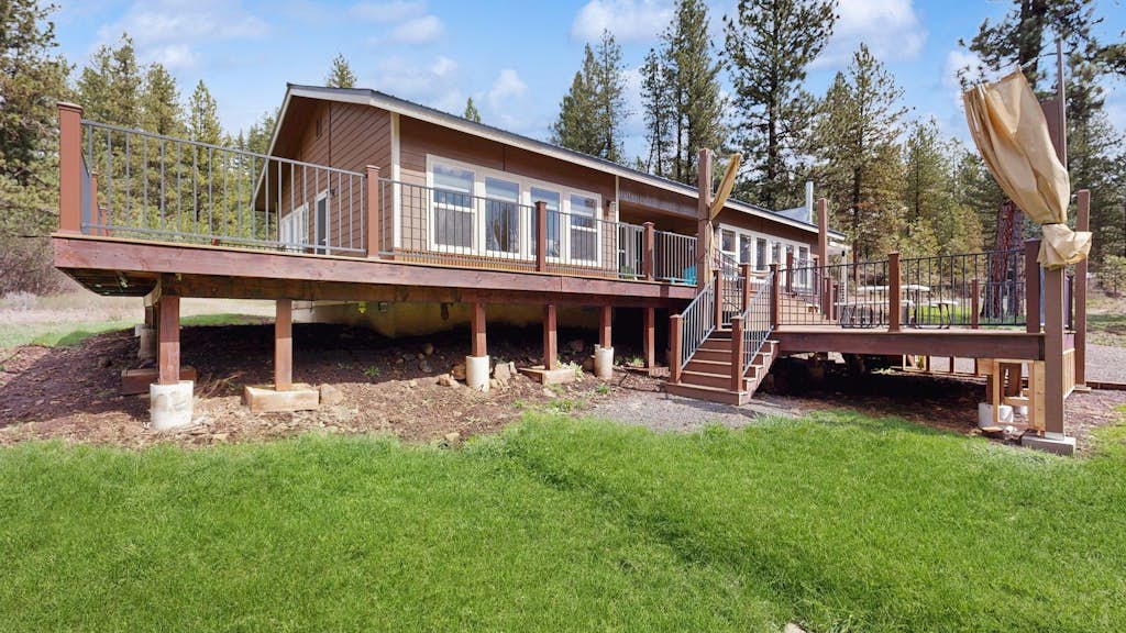 A secluded mountain retreat, located in the MeadowCreek Golf Resort, surrounded by trees and designed for quiet getaways in every season. Large picture windows, a wraparound deck, and multiple outdoor gathering spaces create an easy connection to nature, while the game room, wood stove, and updated kitchen make relaxing at home just as enjoyable.