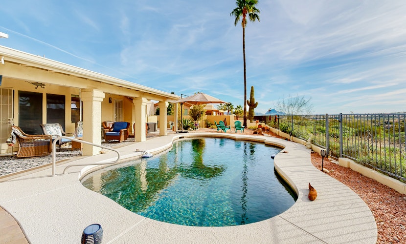 Mountain-view home with pool, furnished patio, washer/dryer & central AC