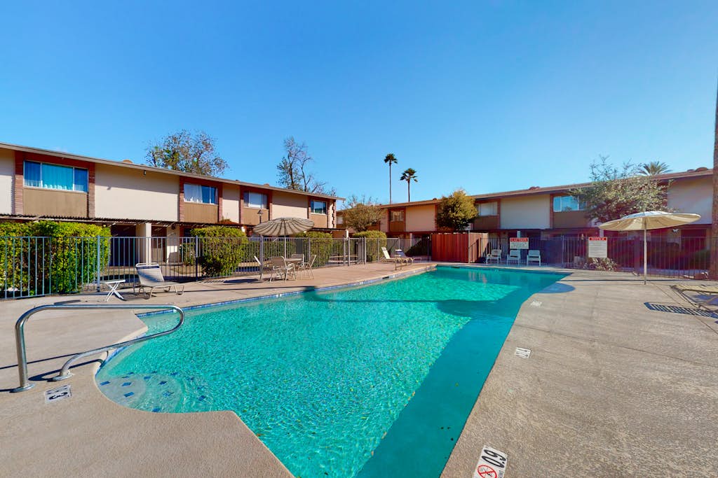 2-story dog-friendly condo with patio, outdoor pool, W/D, streaming, partial AC