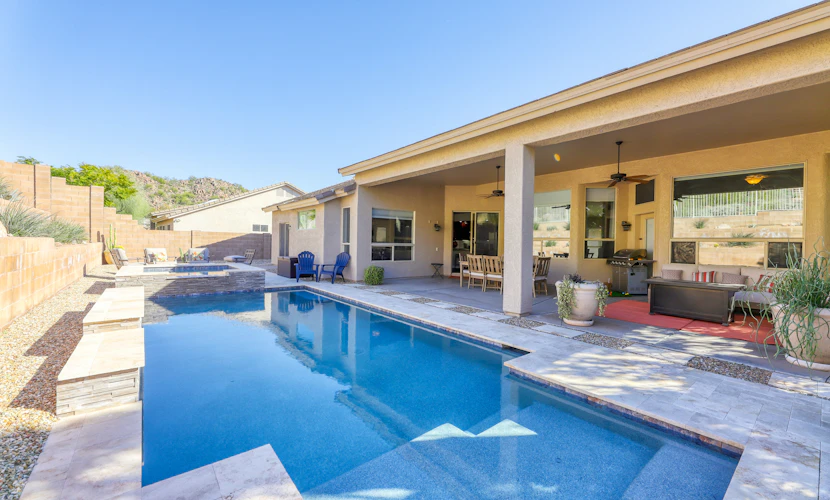 Private desert dream home with enclosed yard, pool, furnished lanai, & grill
