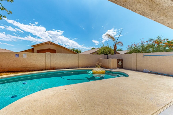 Updated home with private pool, enclosed yard, covered patio, grill, & W/D