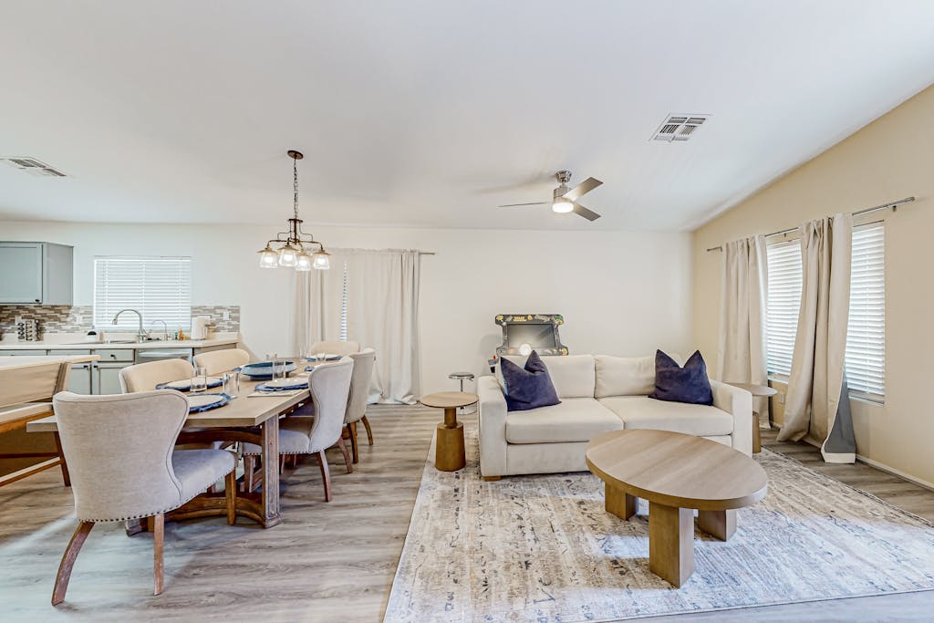 Spacious desert home with hot tub, covered patio, grill, & modern finishes