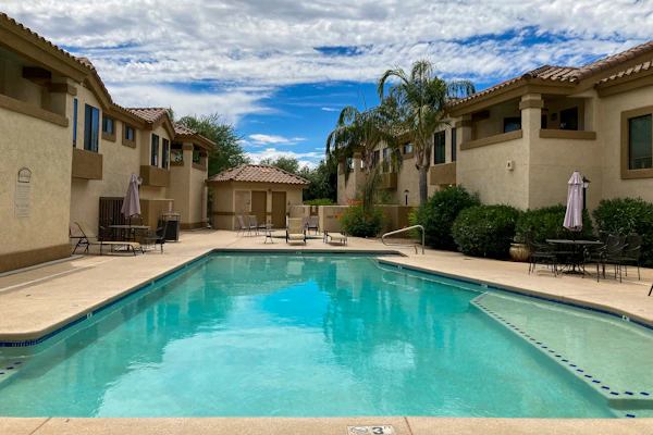 Dog-friendly mountain view condo with pool, gym, grill, fireplace, & sunroom
