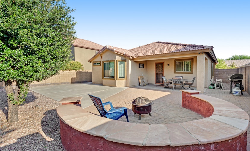 Desert oasis with an enclosed yard, firepit, washer/dryer, and central AC