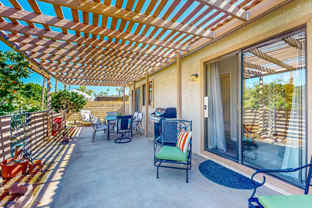 Gated community home with 2 pools, hot tubs, private patio, AC, & W/D