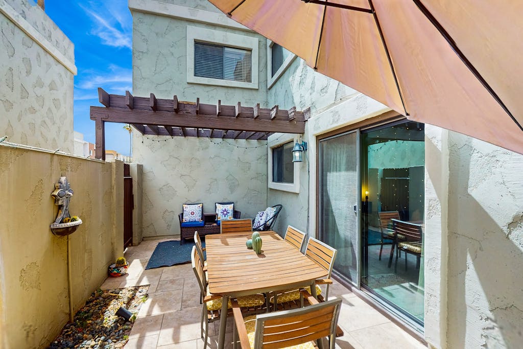 Ground floor condo w/ private patio & direct access to shared pool, dog-friendly