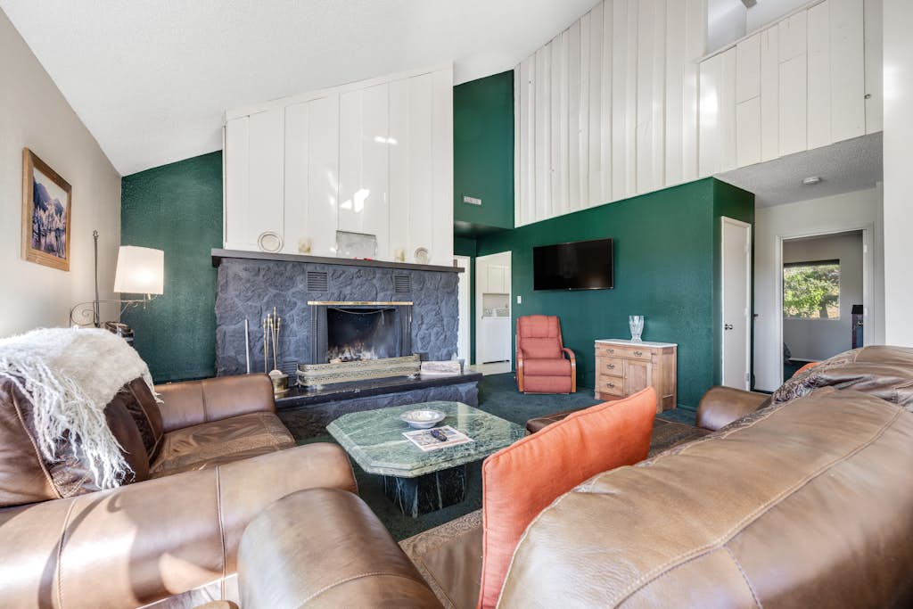 Refined home with a game room, balcony, grill, washer/dryer, & four bedrooms