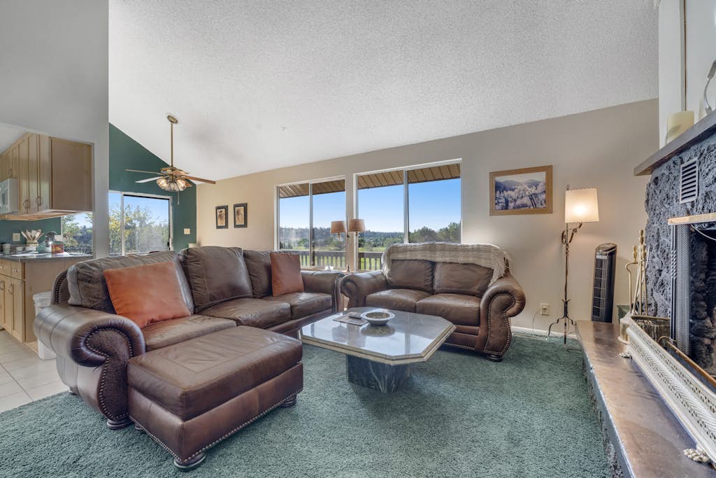 Refined home with a game room, balcony, grill, washer/dryer, & four bedrooms