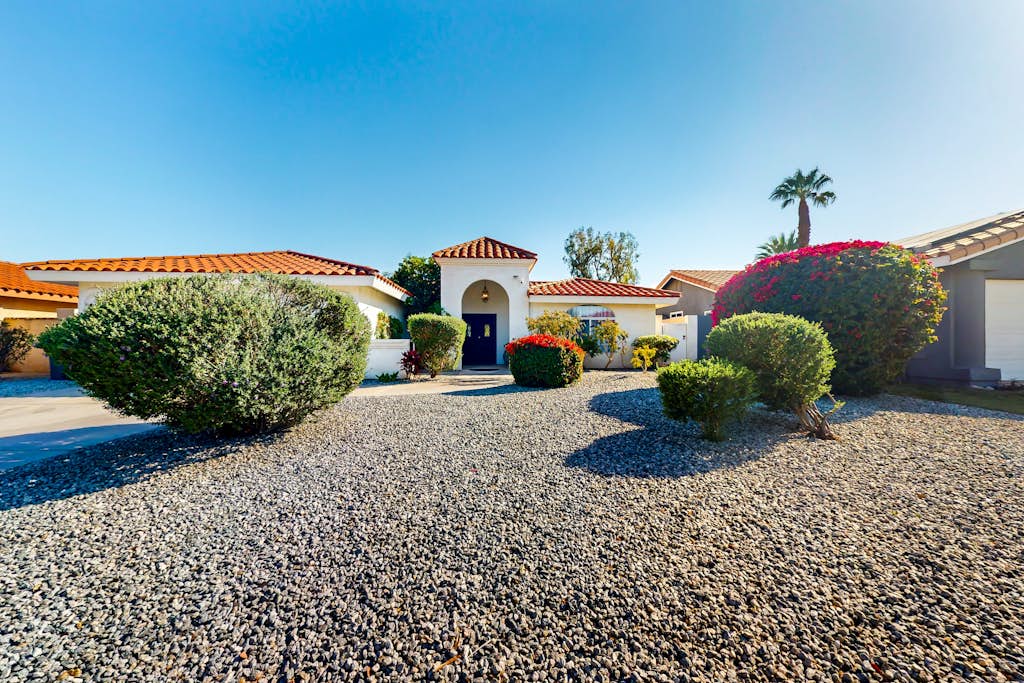 Golf course-front home with private pool, pool spa, fireplace, grill, & hammock