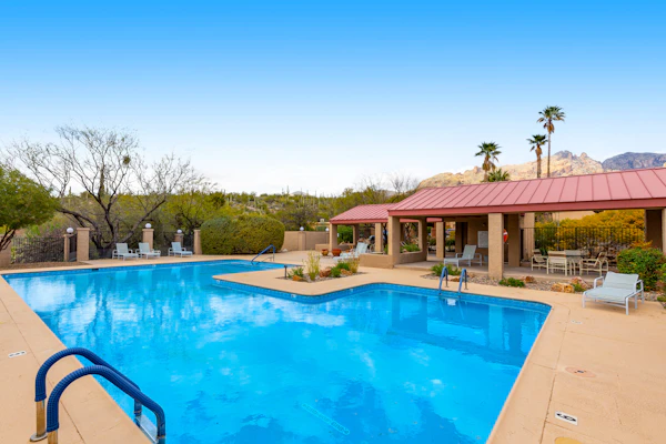 Inviting townhouse with pool, enclosed yard, patio, mountain view & W/D