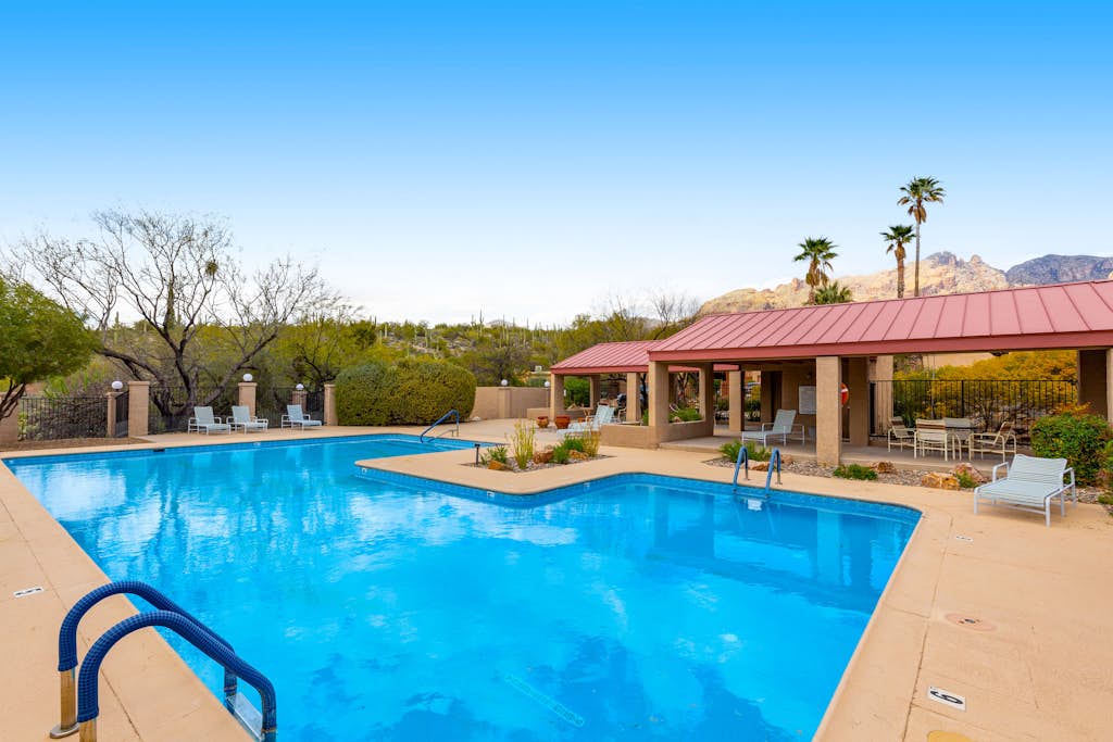 Inviting townhouse with pool, enclosed yard, patio, mountain view & W/D