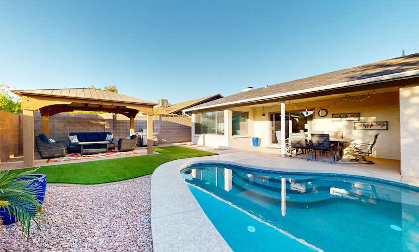 Updated home with enclosed yard, pool, grill, full kitchen, games, W/D, & AC