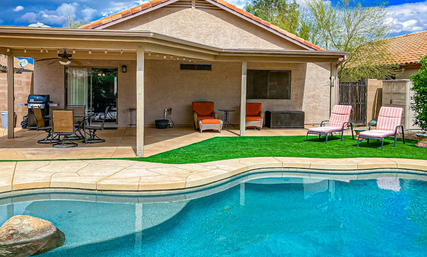 Desert charmer with enclosed yard, heated pool, smart TVs, W/D, & full kitchen