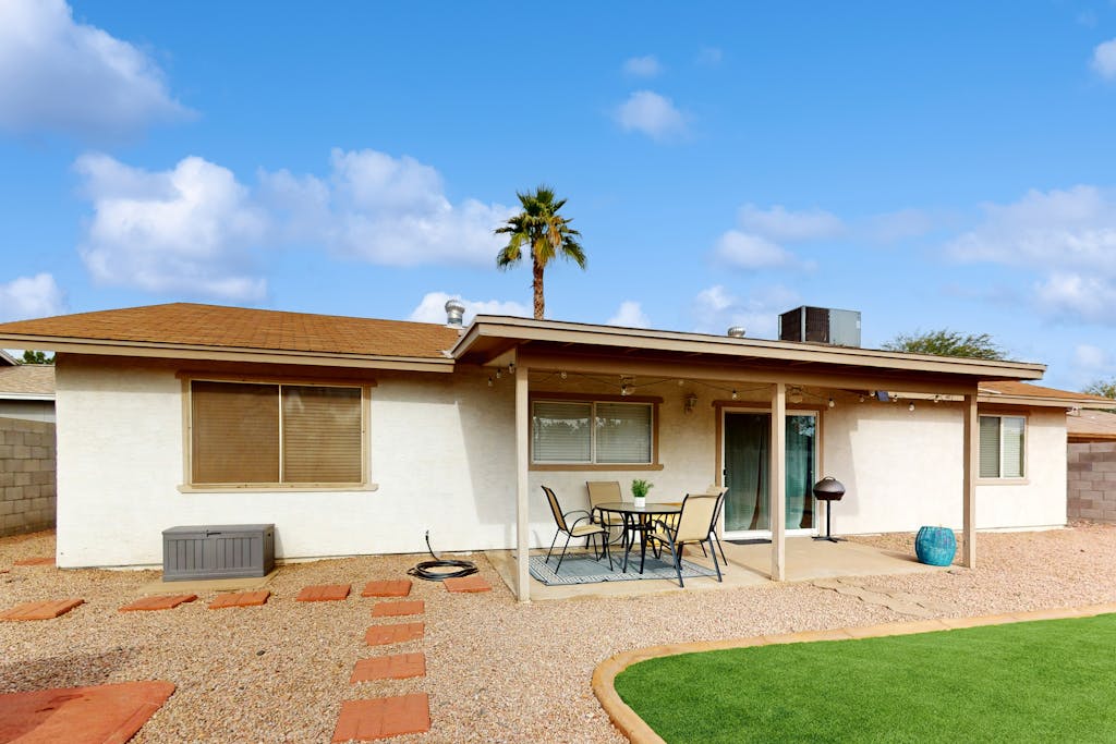 Single-level vacation home with fenced yard, furnished patio, & washer/dryer