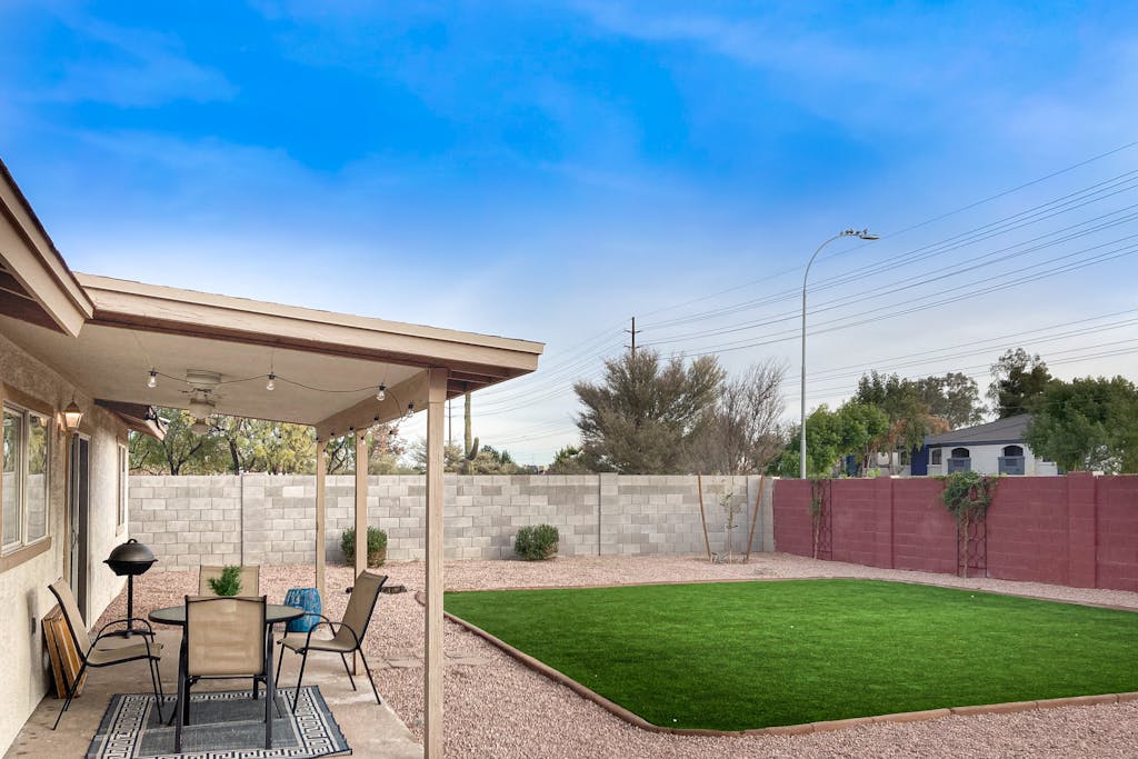 Single-level vacation home with fenced yard, furnished patio, & washer/dryer