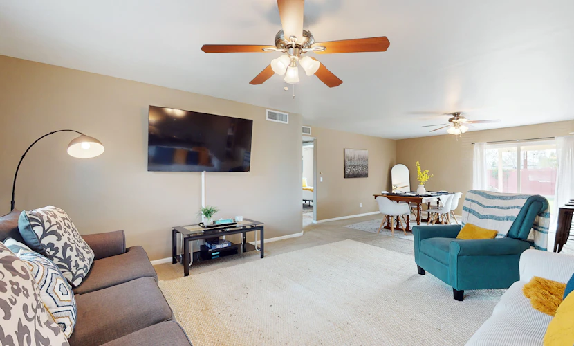 Single-level vacation home with fenced yard, furnished patio, & washer/dryer