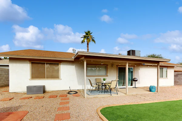 Single-level vacation home with fenced yard, furnished patio, & washer/dryer