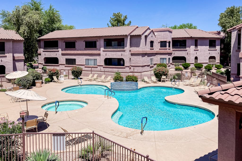 Second-floor condo with heated pool, hot tub, balcony, central AC & washer/dryer