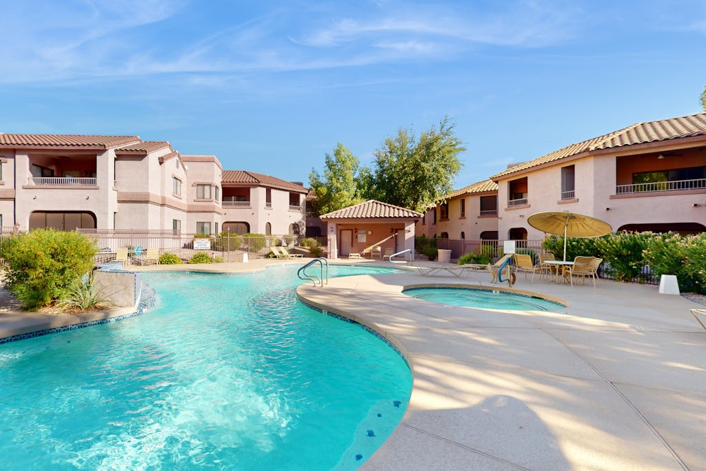 Modern ground-level townhome with two screened patios, grill, pool & hot tub
