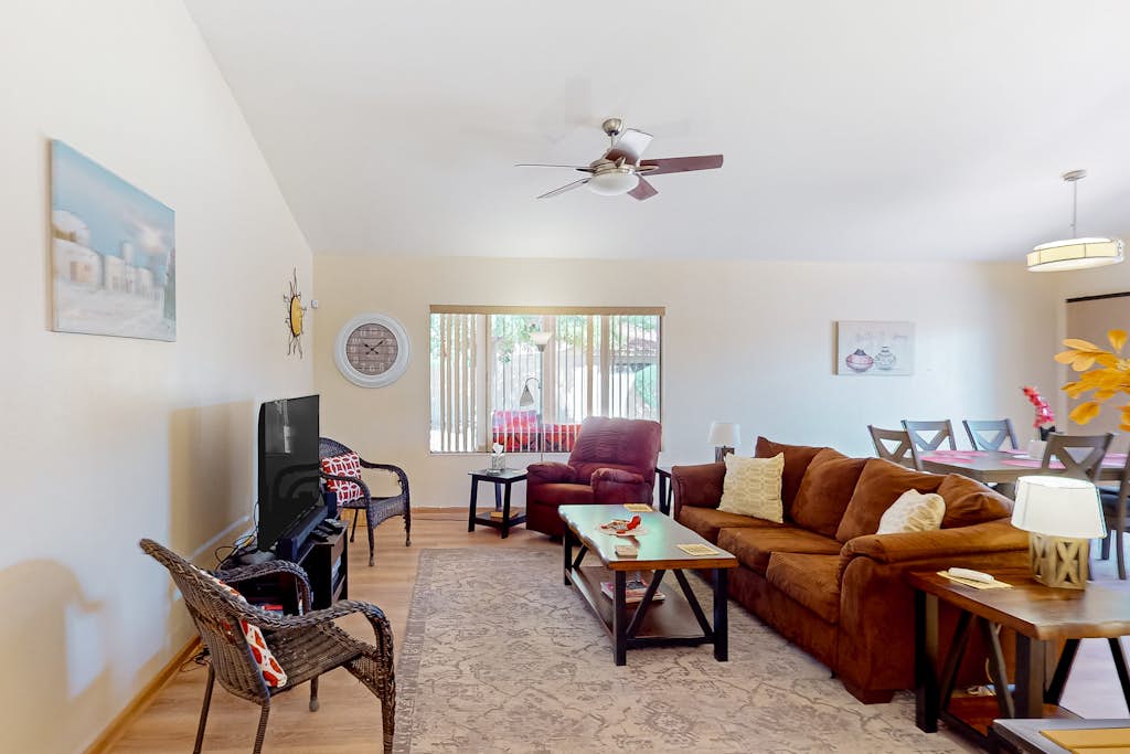 Mountain-view home with shaded patio, large yard, on-site golf & tennis