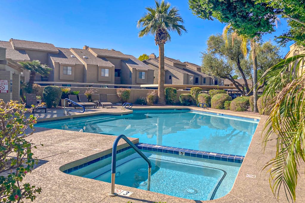 First floor condo with pool/hot tub, private yard, central location