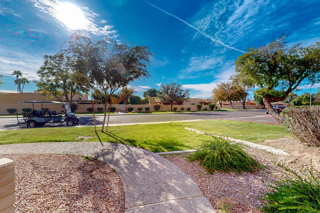 First floor condo with pool/hot tub, private yard, central location