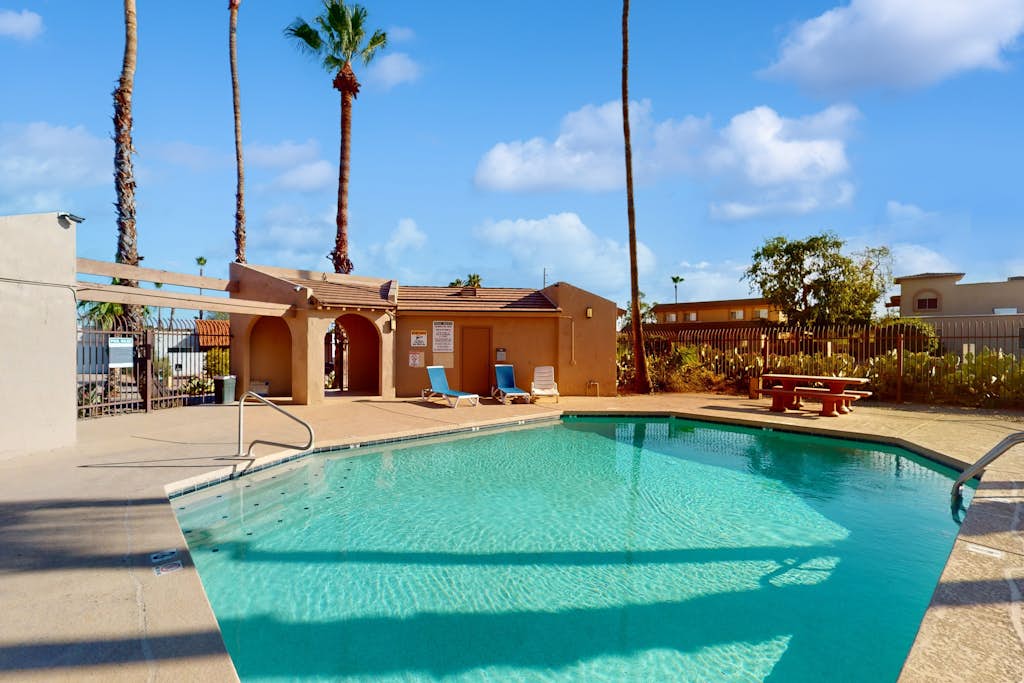 Modern townhome with pool, AC, W/D, grill, and private patio