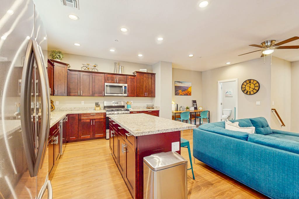 Modern home w/ two master suites & private balcony, desk space, & central A/C