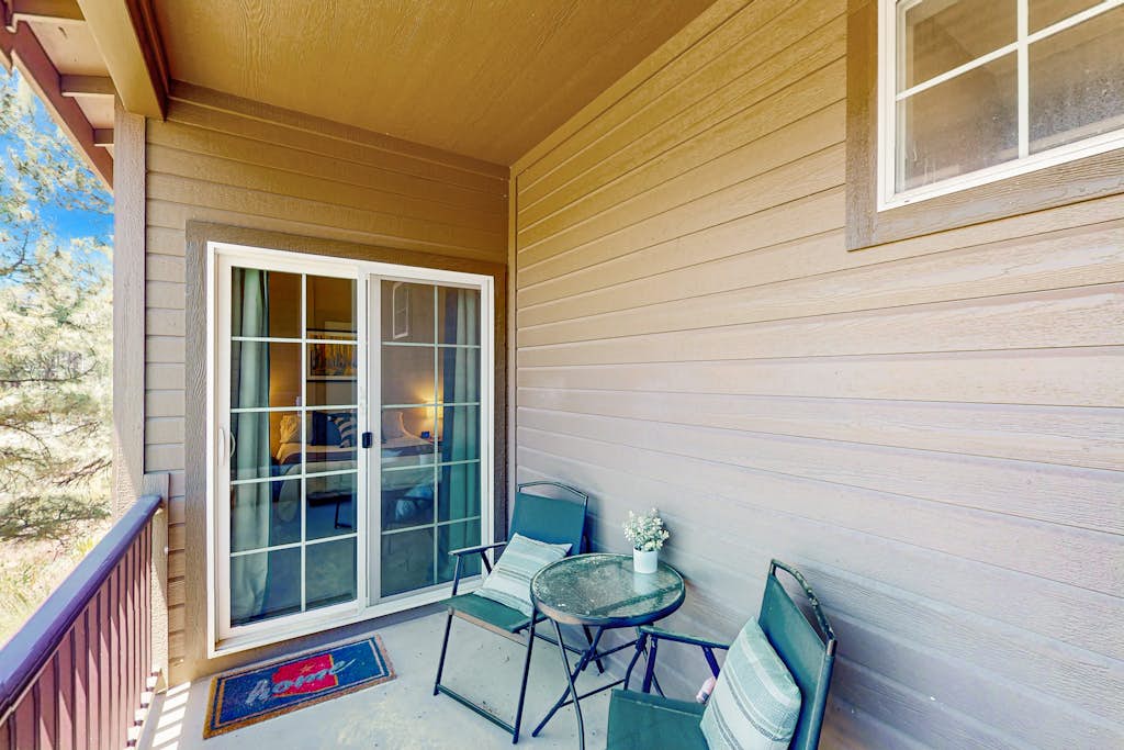 Modern home w/ two master suites & private balcony, desk space, & central A/C