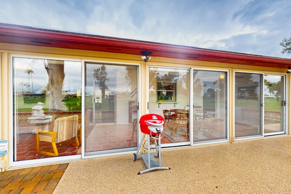 Snowbird-friendly golf-front home with pool, hot tub, grill, smart TVs, W/D, AC