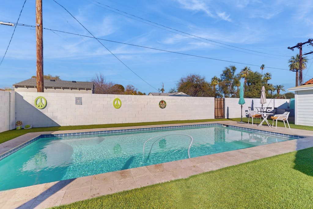 Sunny downtown home with private pool, hammock, enclosed backyard, grill, patio