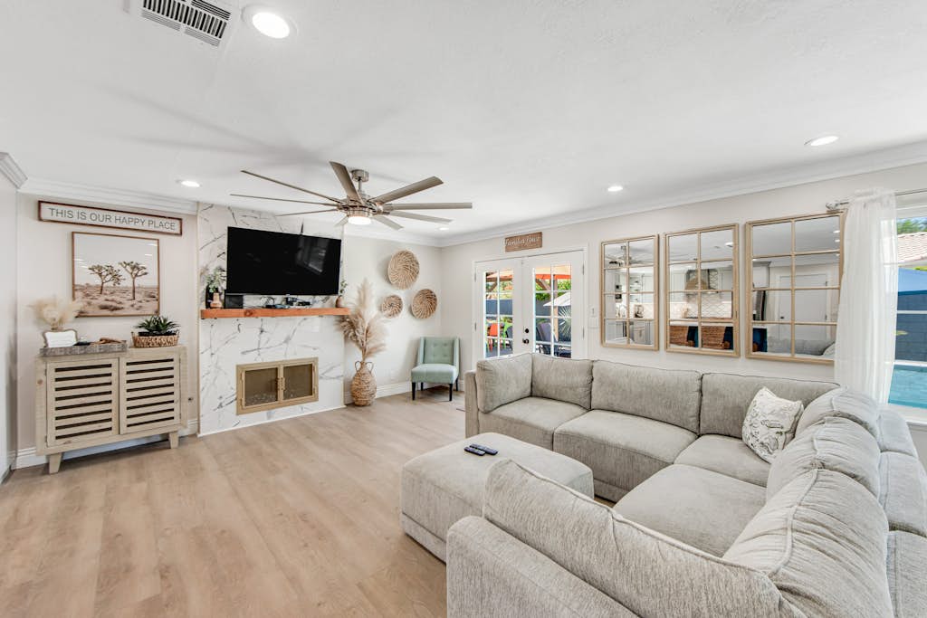 Designer dream with fireplace, game room, private pool, outdoor kitchen, firepit
