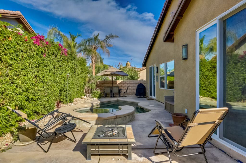 Classic, dog-friendly home near golf with heated pool, enclosed yard & fireplace