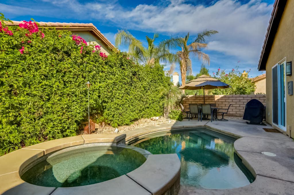 Classic, dog-friendly home near golf with heated pool, enclosed yard & fireplace