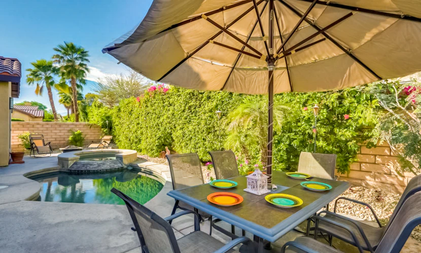 Classic, dog-friendly home near golf with heated pool, enclosed yard & fireplace